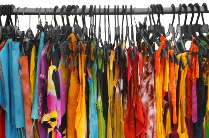 A row of summer clothes hanging on the rack